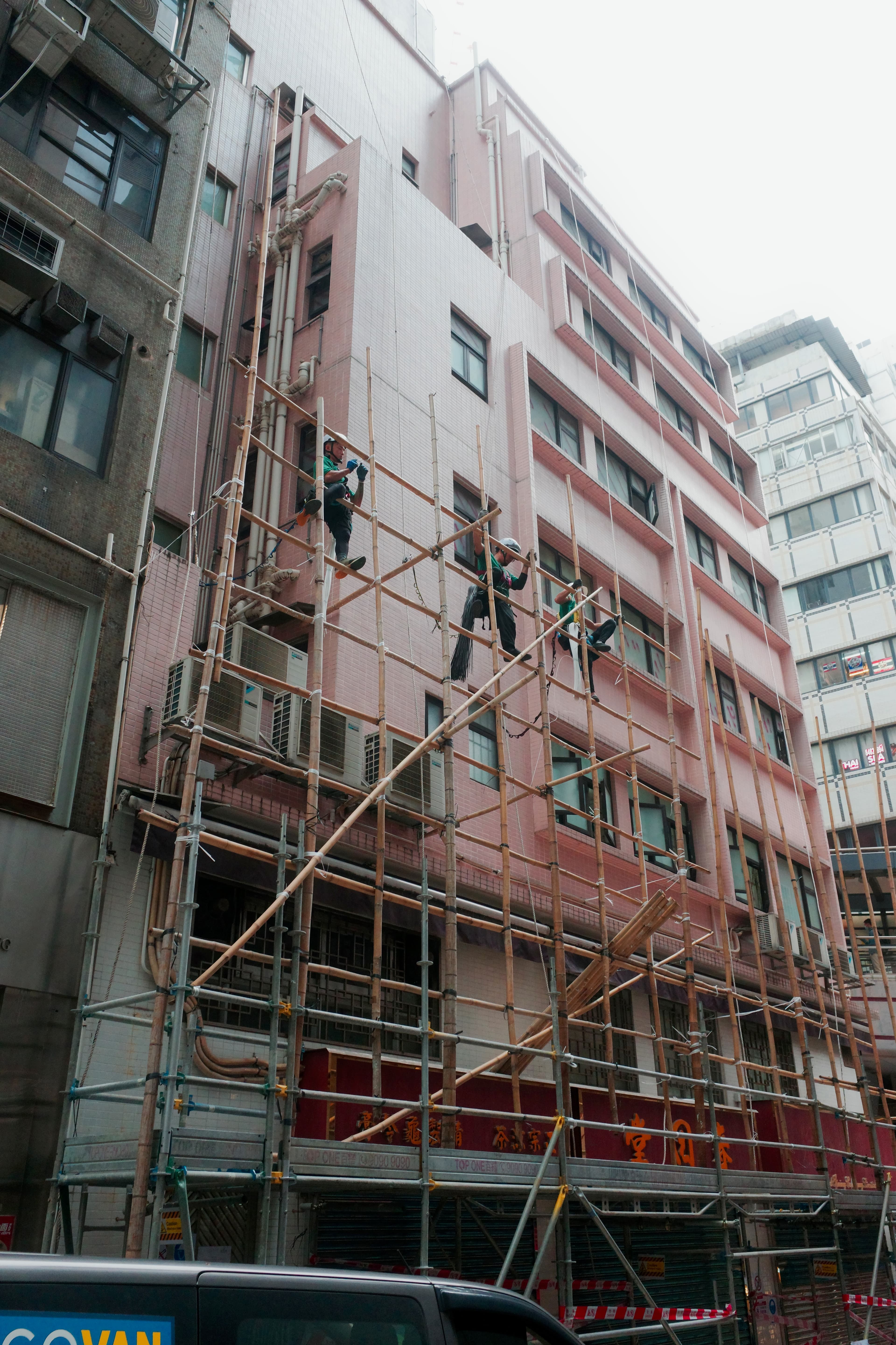 Bamboo scaffolding on pink building